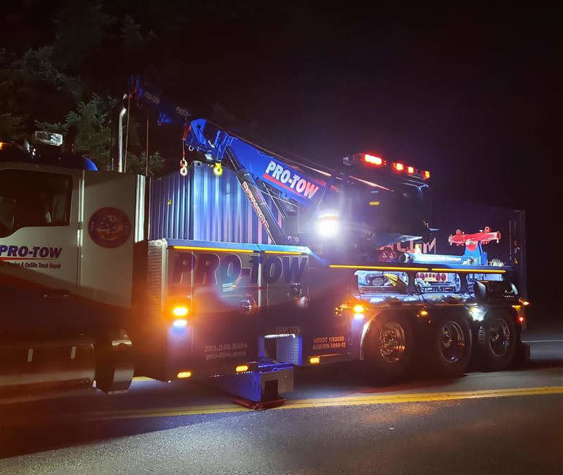 Semi-Truck Accident Spills Container of Clothing on Highway 18