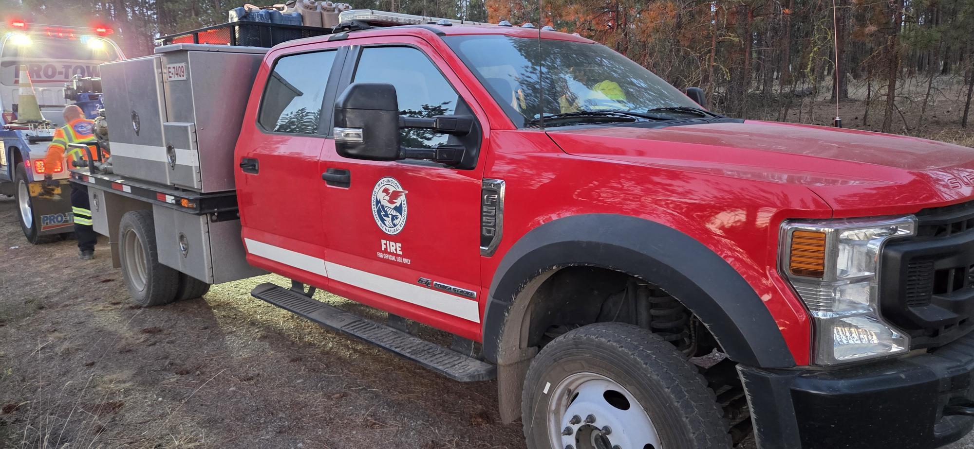 Emergency roadside assistance - tire change for a firefighter's truck. 