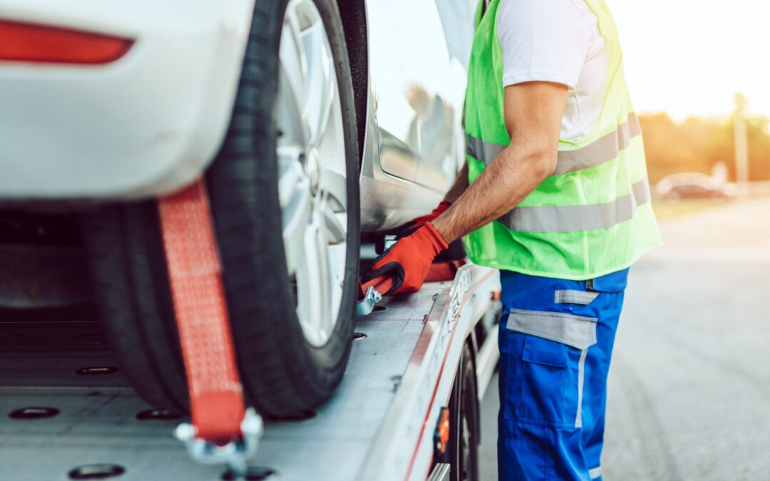 Handsome middle age man working in towing service on the road. R